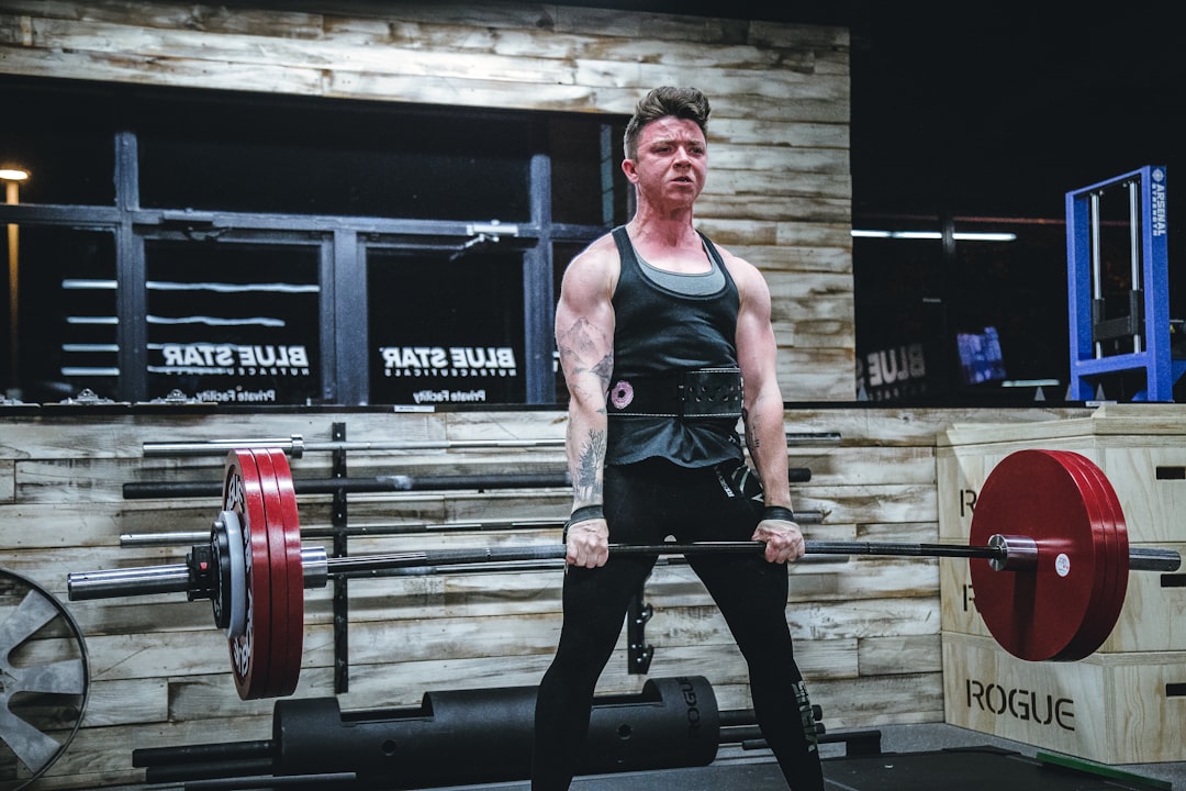 Beginner Strength Training Plan cover with dumbbells, a checklist, and a weekly calendar